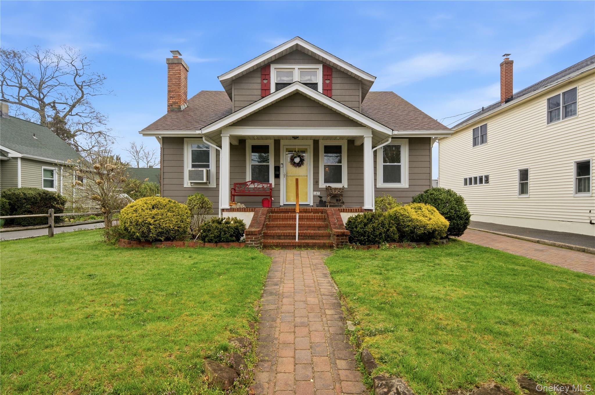 147 Church Avenue Islip, NY 11751 - Photo 1 of 40 a front view of a house with garden