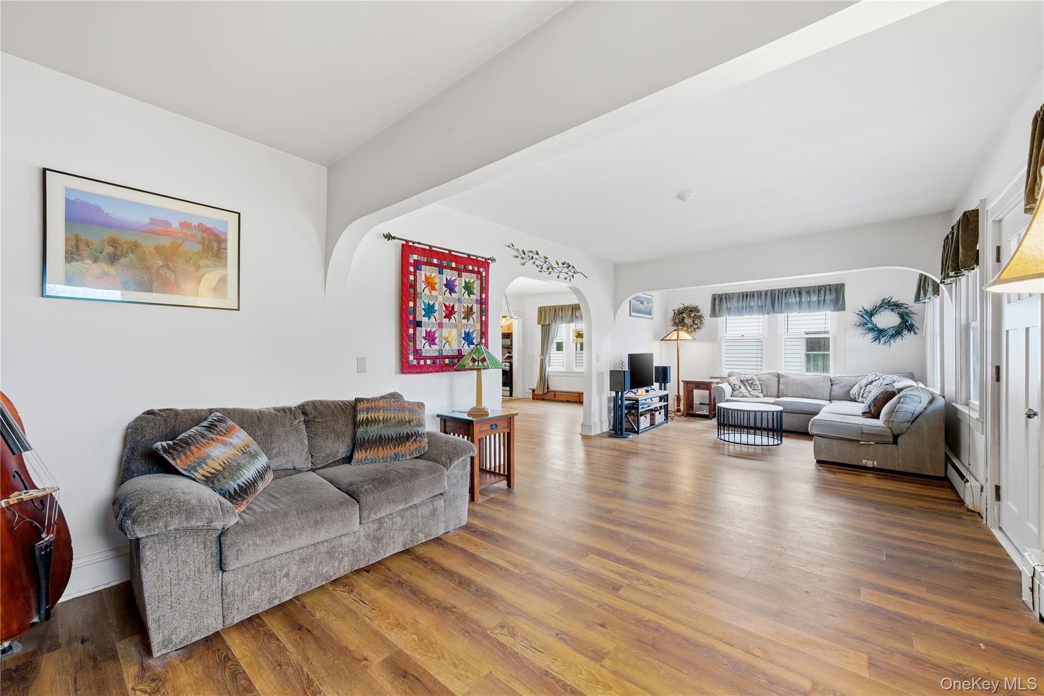 147 Church Avenue Islip, NY 11751 - Photo 11 of 40 a living room with furniture and a wooden floor