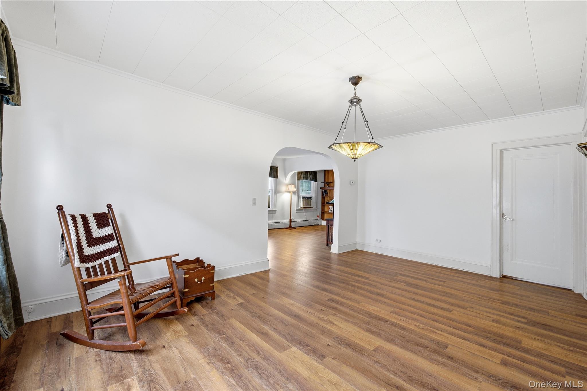 147 Church Avenue Islip, NY 11751 - Photo 13 of 40 a view of a room with wooden floor furniture and a ceiling fan