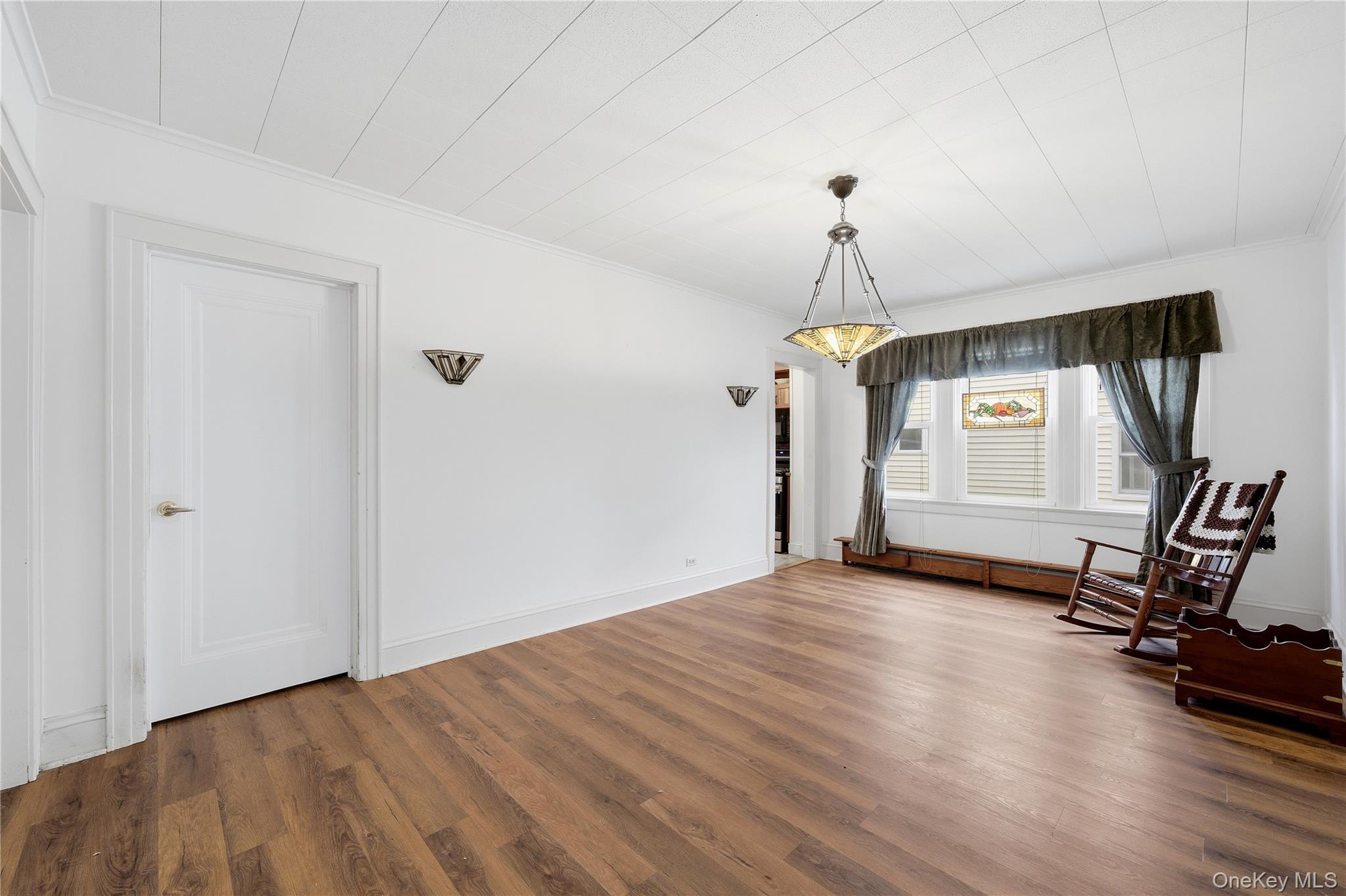 147 Church Avenue Islip, NY 11751 - Photo 14 of 40 a view of a room with gym equipment and wooden floor
