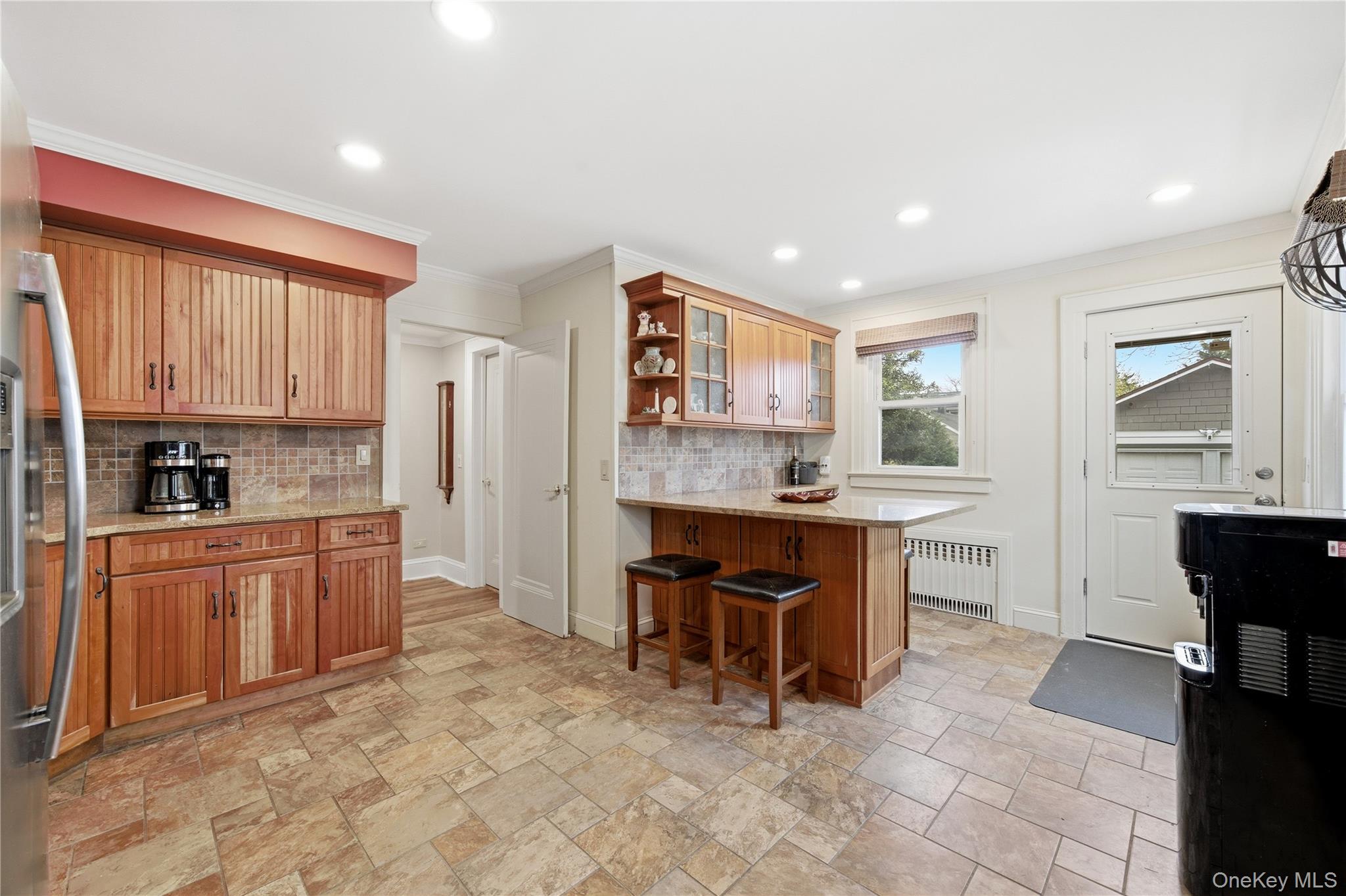147 Church Avenue Islip, NY 11751 - Photo 16 of 40 a large kitchen with kitchen island granite countertop a sink and cabinets