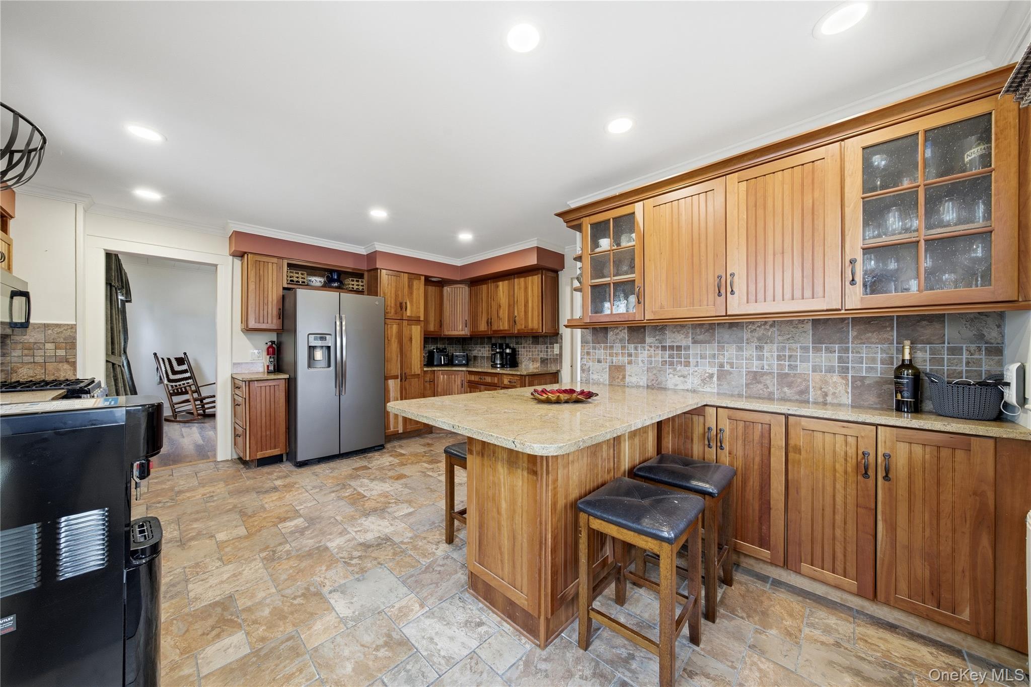 147 Church Avenue Islip, NY 11751 - Photo 19 of 40 a kitchen with refrigerator and cabinets