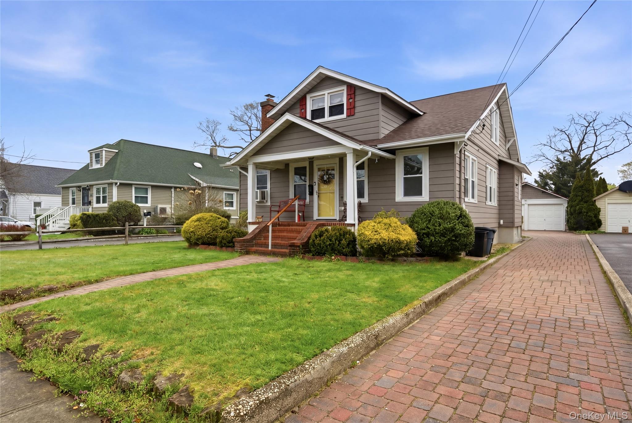147 Church Avenue Islip, NY 11751 - Photo 2 of 40 a front view of a house with a yard