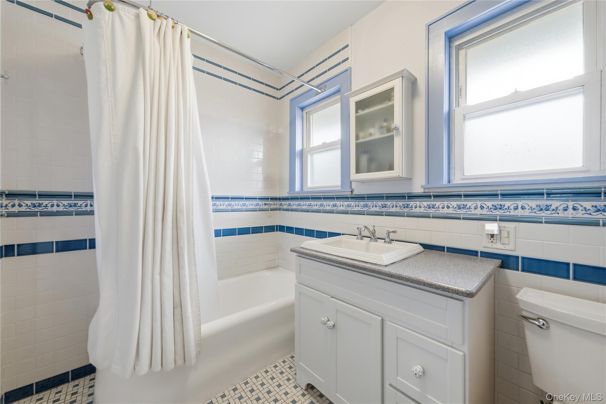 147 Church Avenue Islip, NY 11751 - Photo 23 of 40 a bathroom with a sink and a bathtub