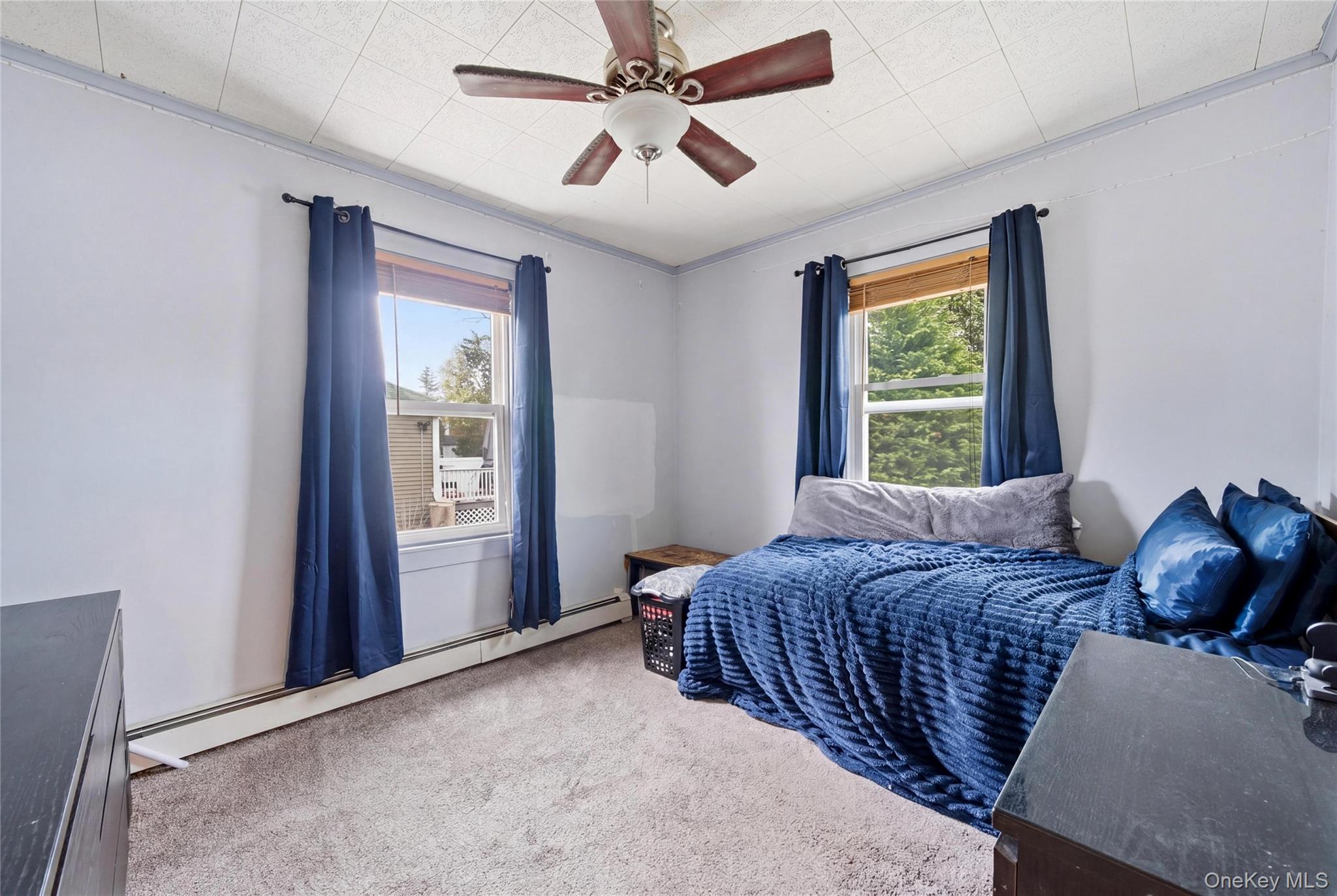 147 Church Avenue Islip, NY 11751 - Photo 24 of 40 a bedroom with a bed and a window
