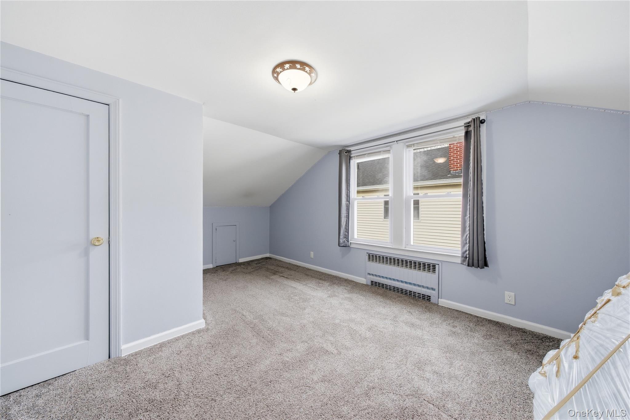 147 Church Avenue Islip, NY 11751 - Photo 26 of 40 a view of an empty room with a window