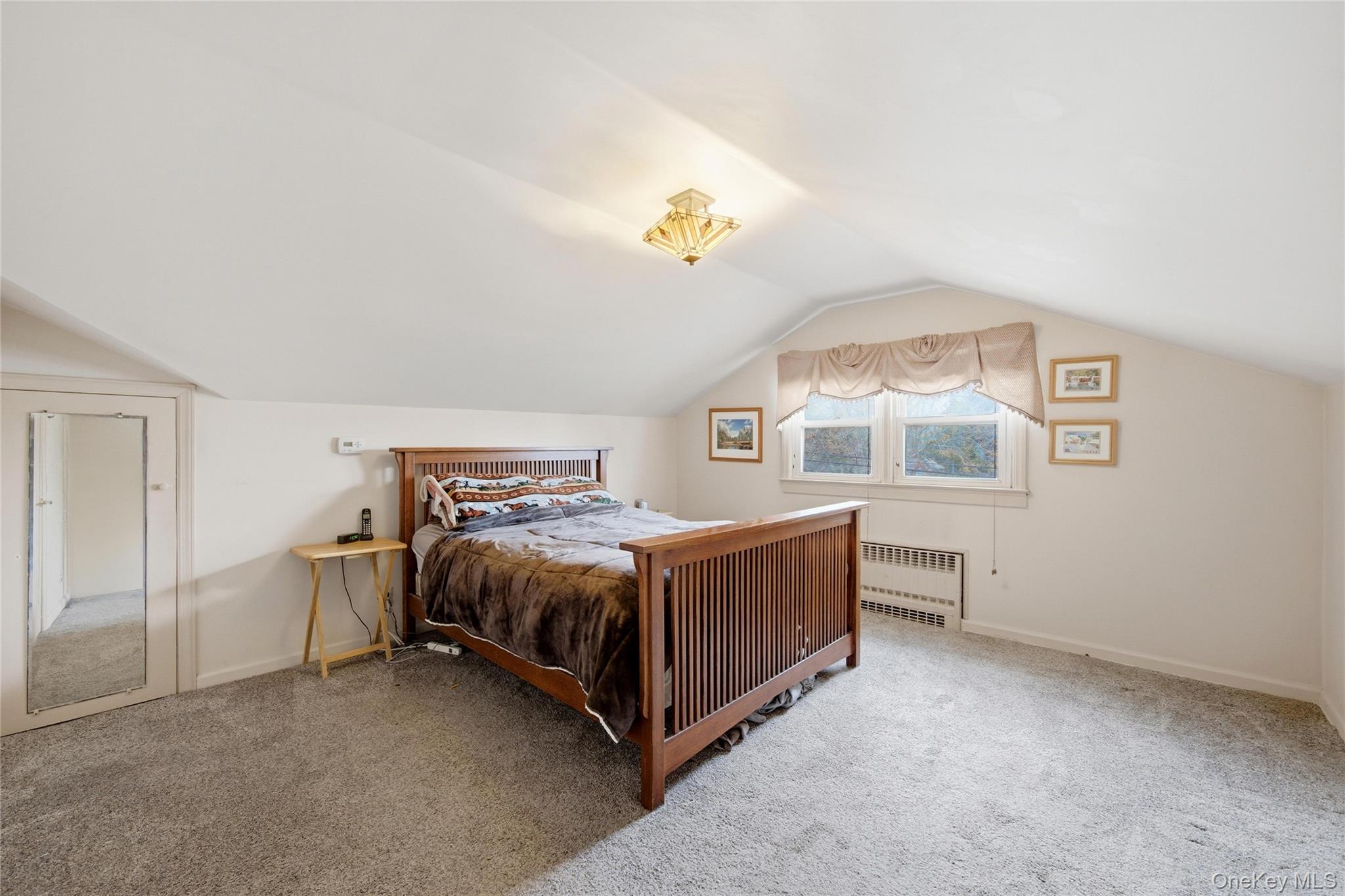 147 Church Avenue Islip, NY 11751 - Photo 27 of 40 a bed room with a bed and a window