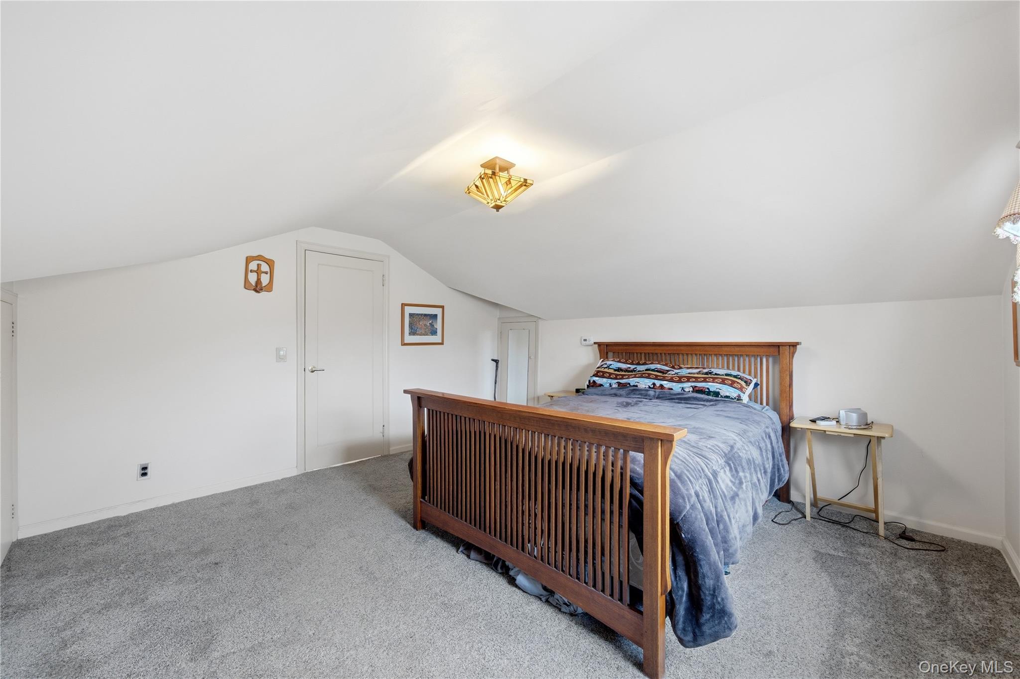147 Church Avenue Islip, NY 11751 - Photo 28 of 40 a bedroom with a bed and window