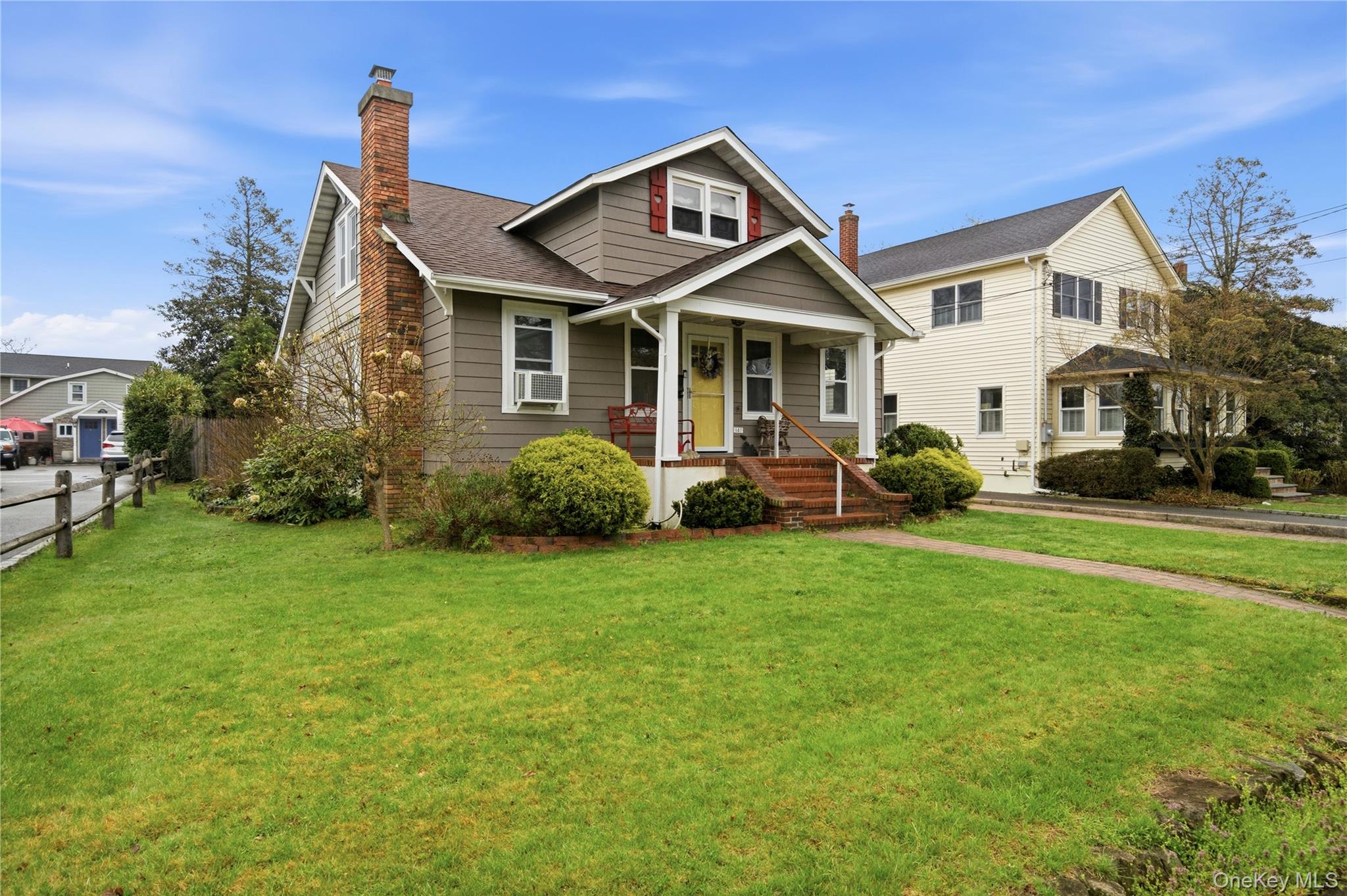147 Church Avenue Islip, NY 11751 - Photo 3 of 40 a front view of a house with a garden