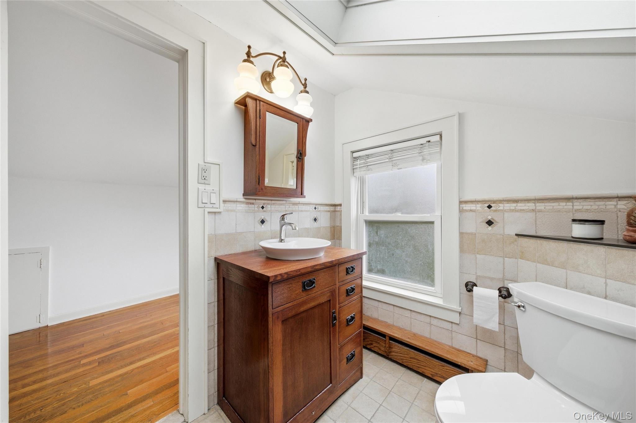 147 Church Avenue Islip, NY 11751 - Photo 31 of 40 a bathroom with a sink toilet vanity and tub