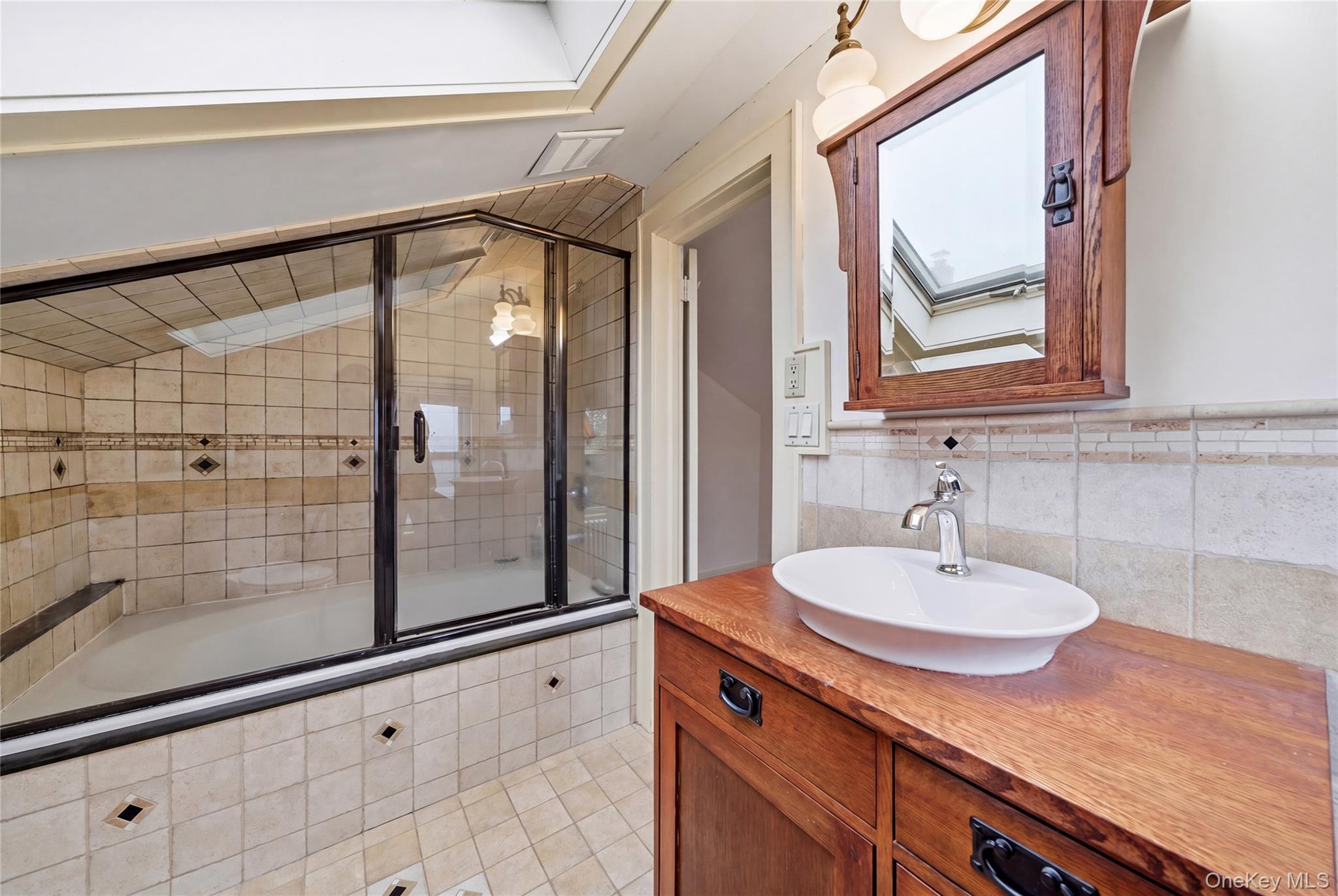 147 Church Avenue Islip, NY 11751 - Photo 32 of 40 a bathroom with a sink and a mirror