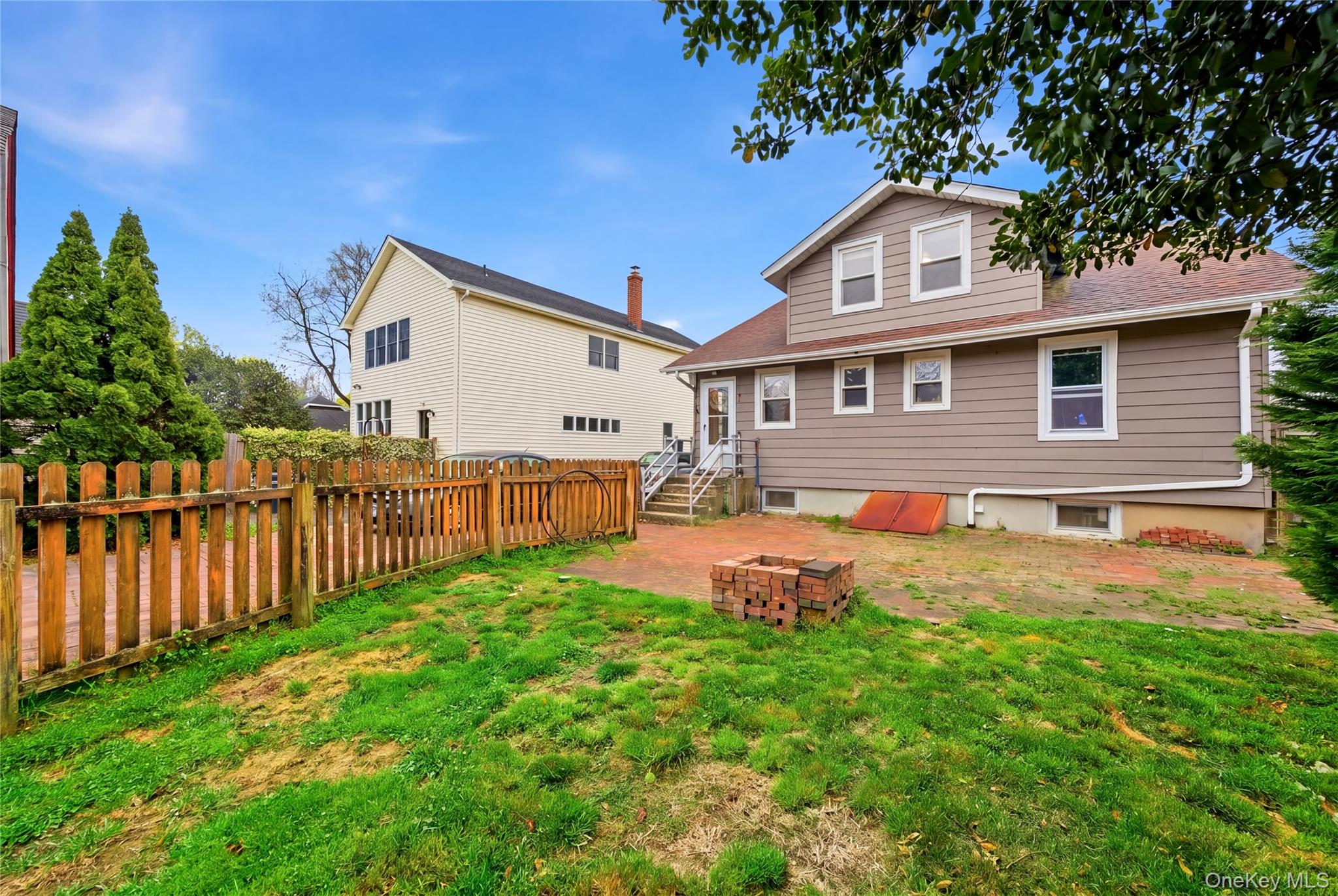 147 Church Avenue Islip, NY 11751 - Photo 38 of 40 a front view of a house with yard and green space