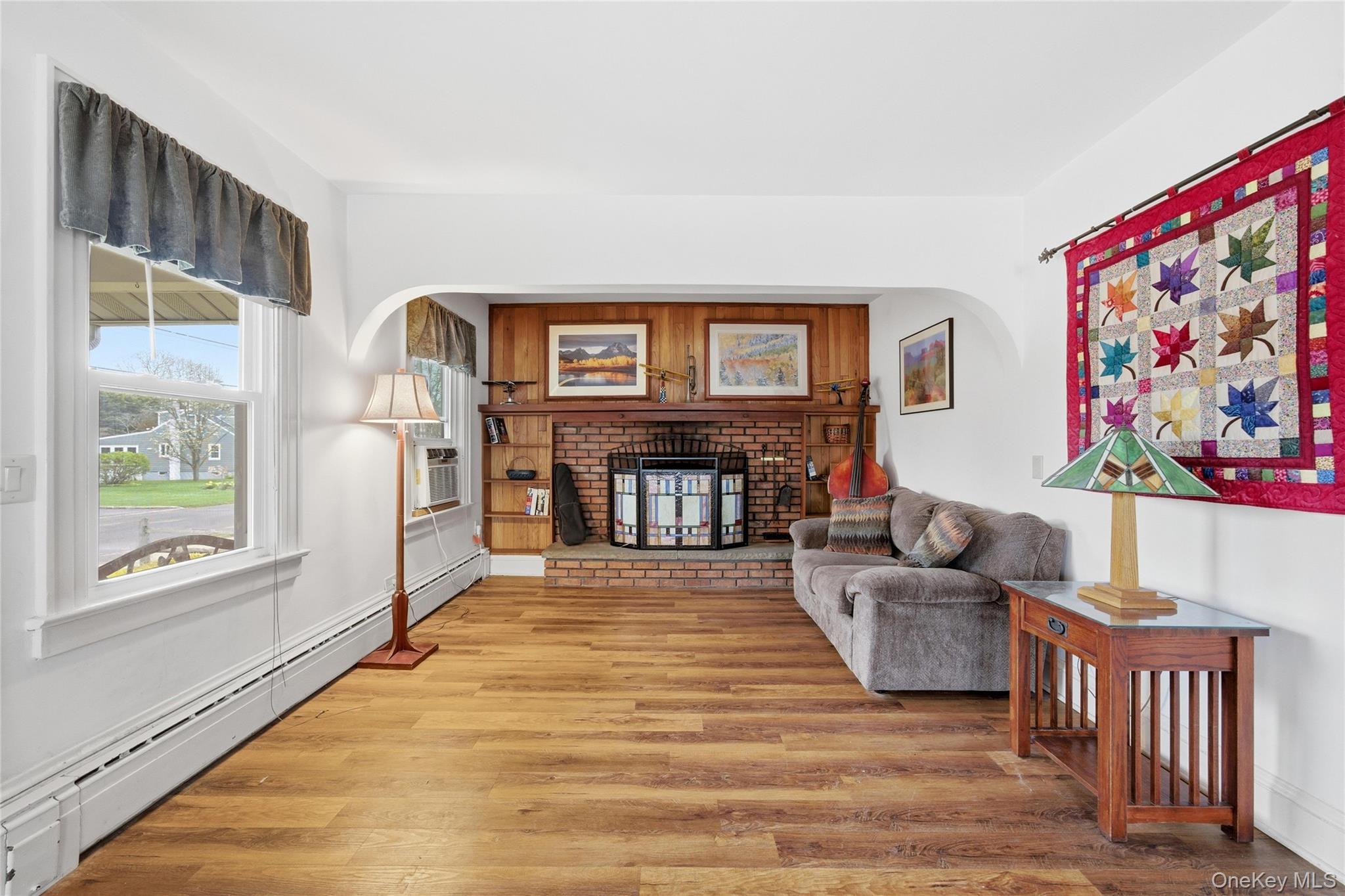 147 Church Avenue Islip, NY 11751 - Photo 4 of 40 a living room with furniture and a fireplace