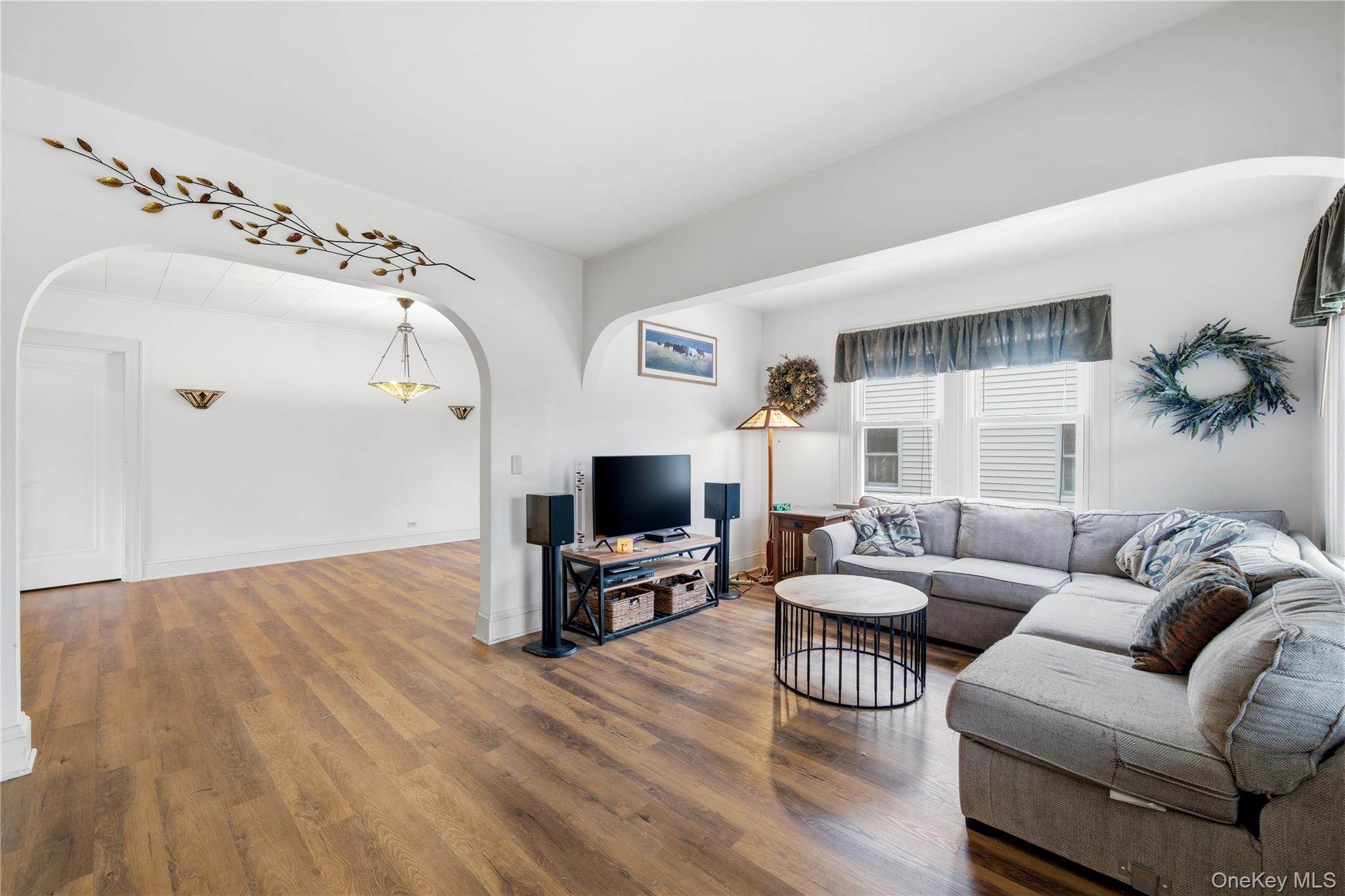 147 Church Avenue Islip, NY 11751 - Photo 8 of 40 a living room with furniture and a flat screen tv