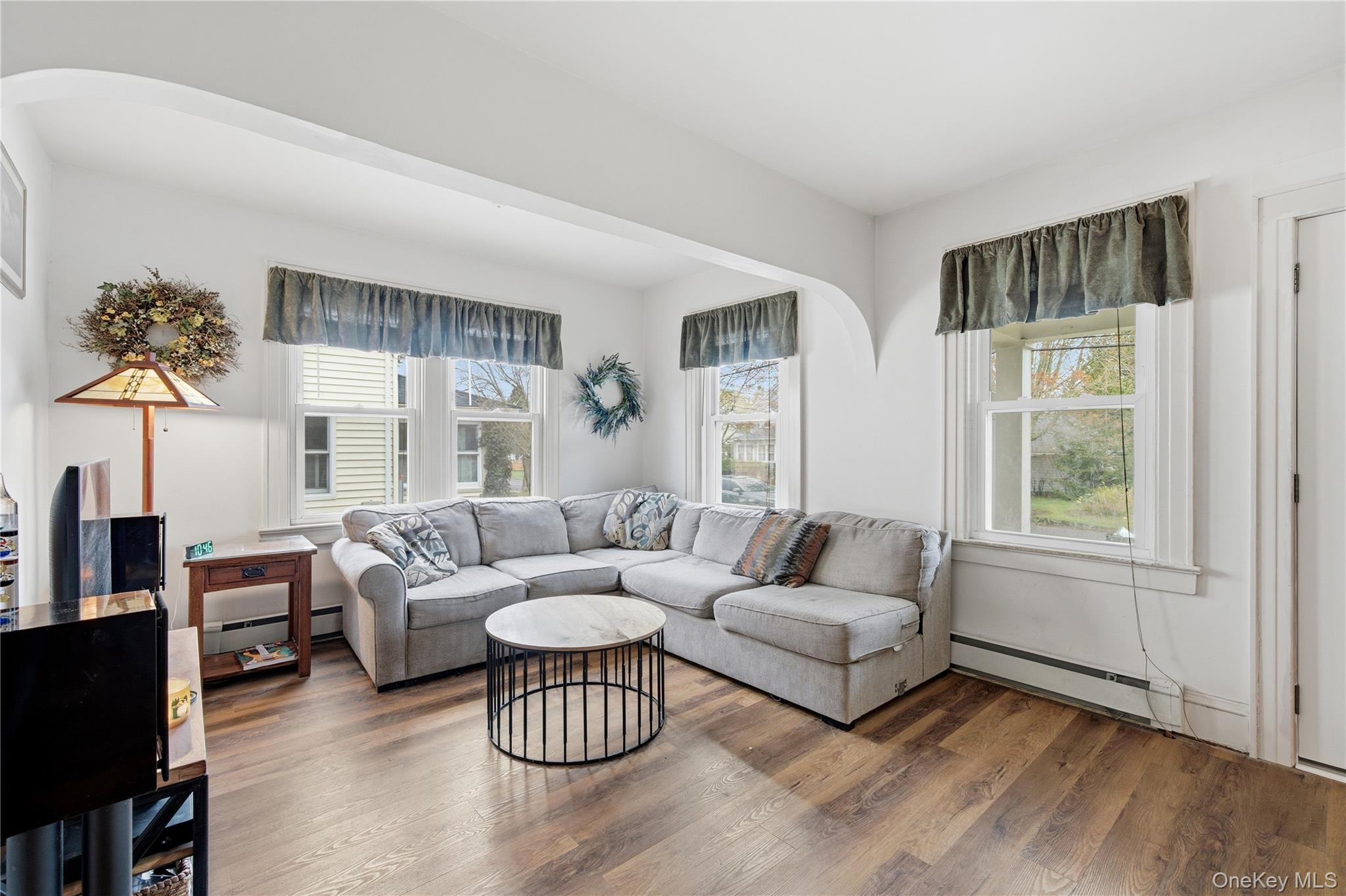 147 Church Avenue Islip, NY 11751 - Photo 9 of 40 a living room with furniture and a potted plant