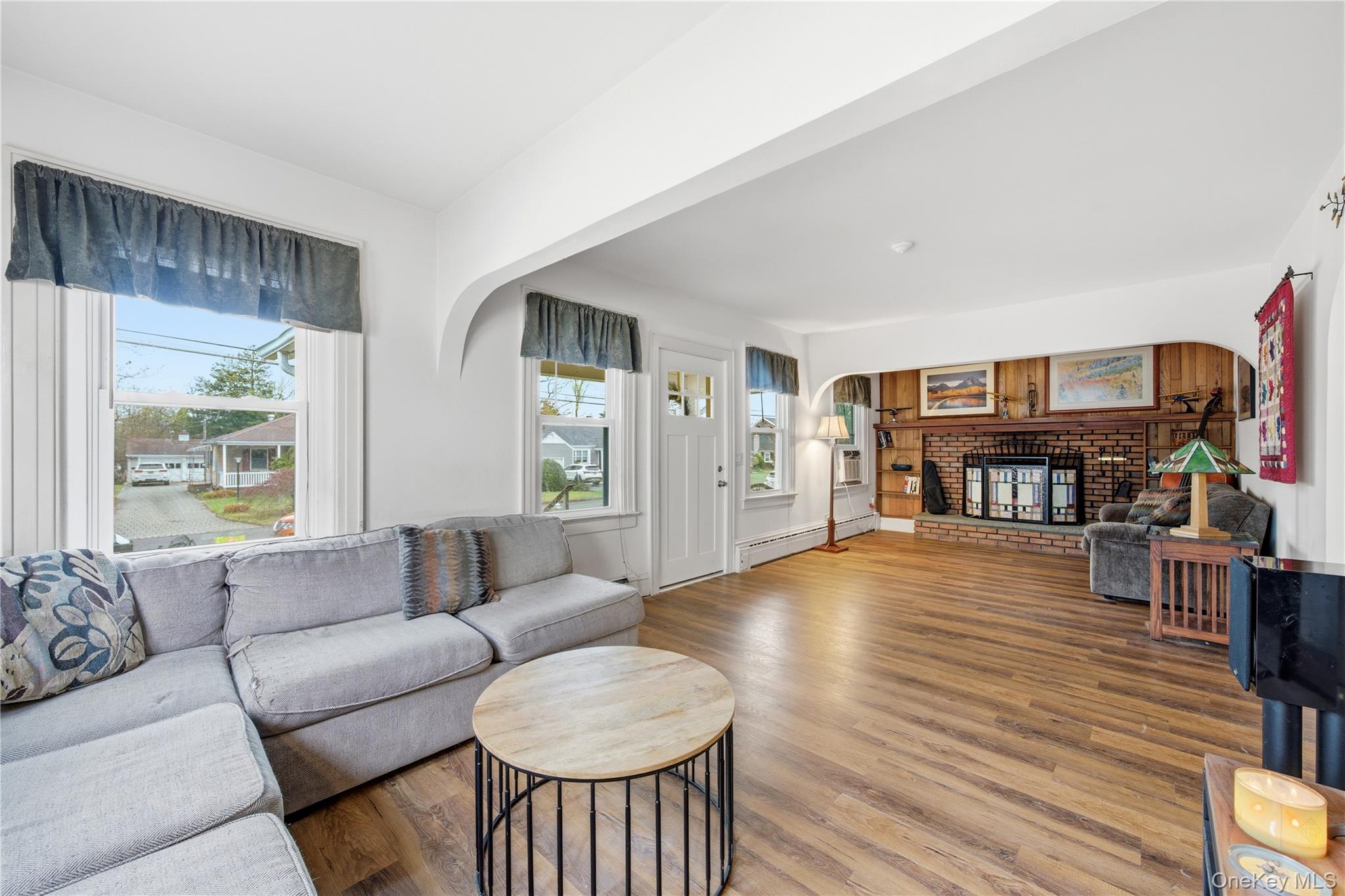 147 Church Avenue Islip, NY 11751 - Photo 10 of 40 a living room with furniture and a wooden floor