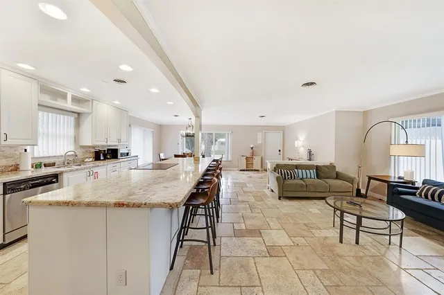 a view of kitchen with dining table and chairs