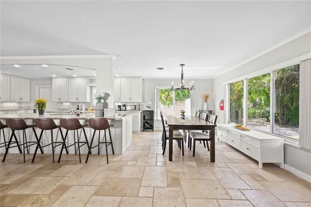 a bathroom with a granite countertop sink a toilet and bathtub