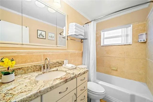 a view of a livingroom with furniture and a window