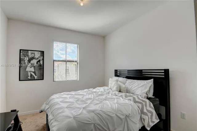 a bedroom with a bed and a closet