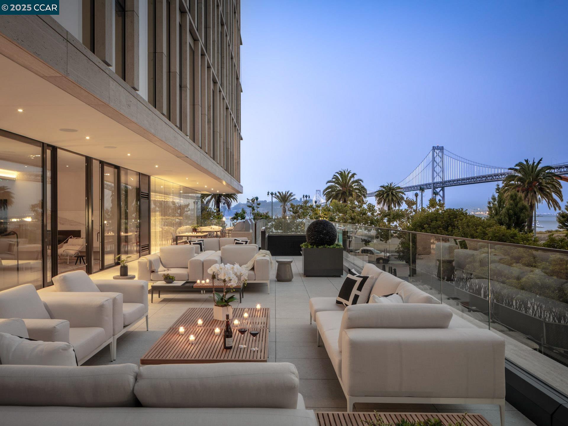 a living room with furniture and a floor to ceiling window