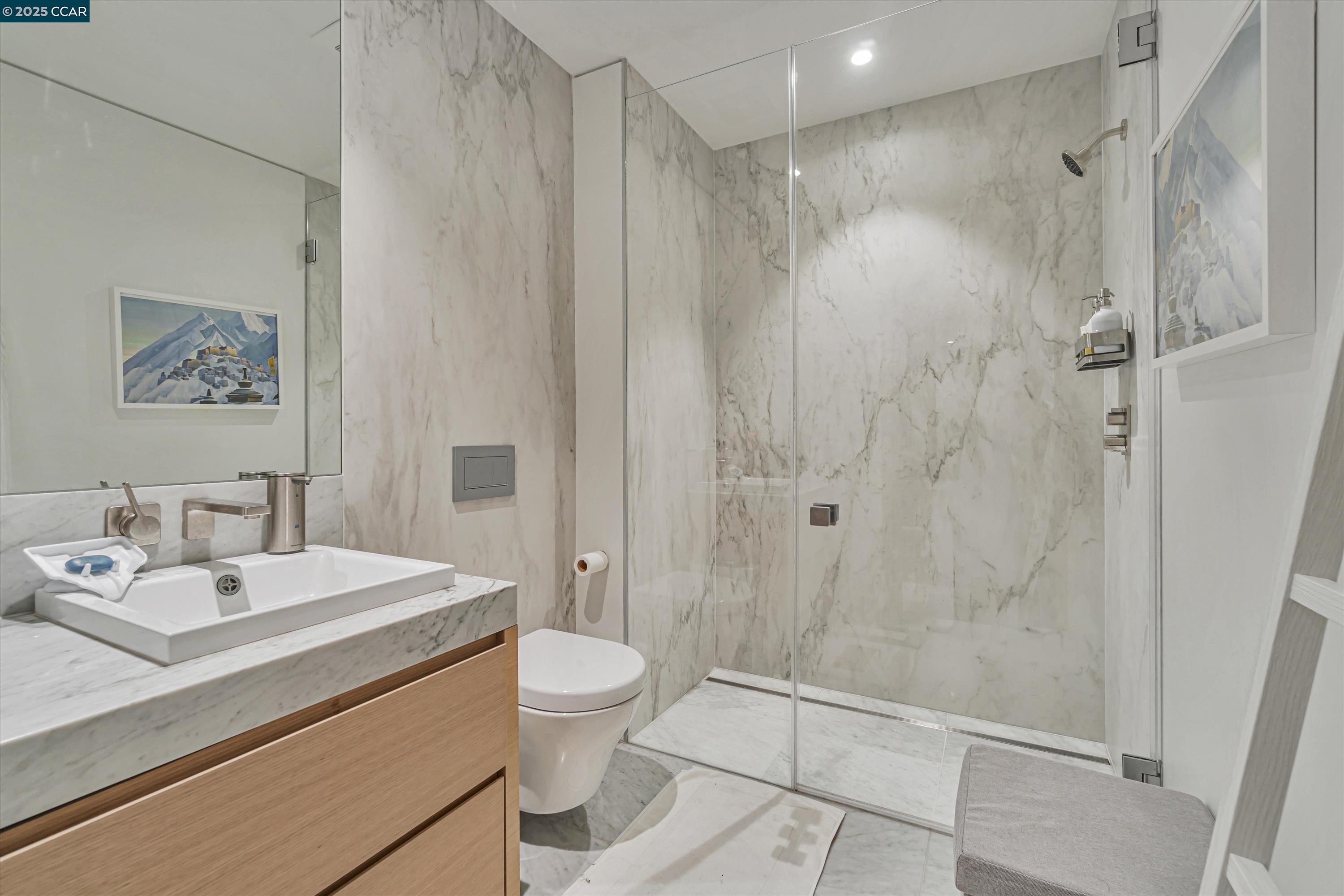 1 Steuart Street, Unit 1103 San Francisco, CA 94105 - Photo 15 of 31 a bathroom with a sink a toilet and shower