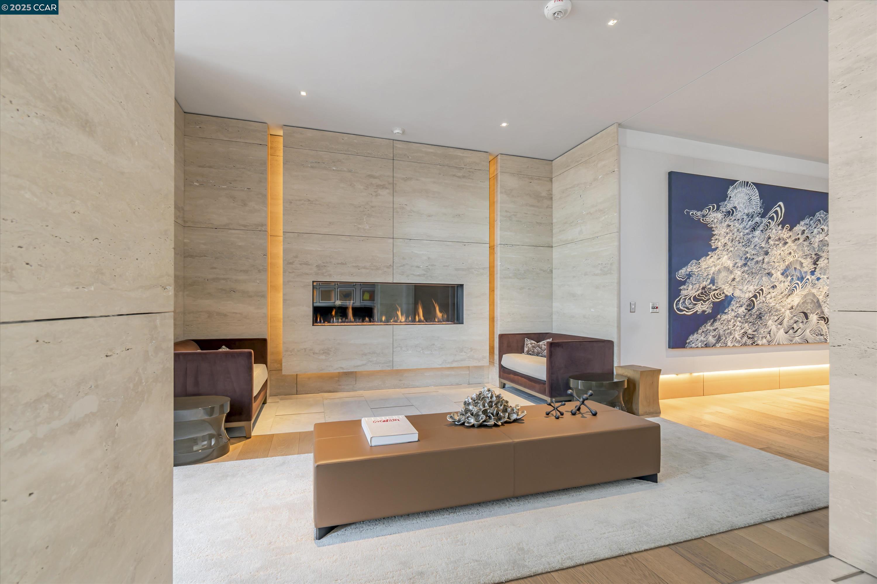 1 Steuart Street, Unit 1103 San Francisco, CA 94105 - Photo 20 of 31 a living room with furniture and a fireplace