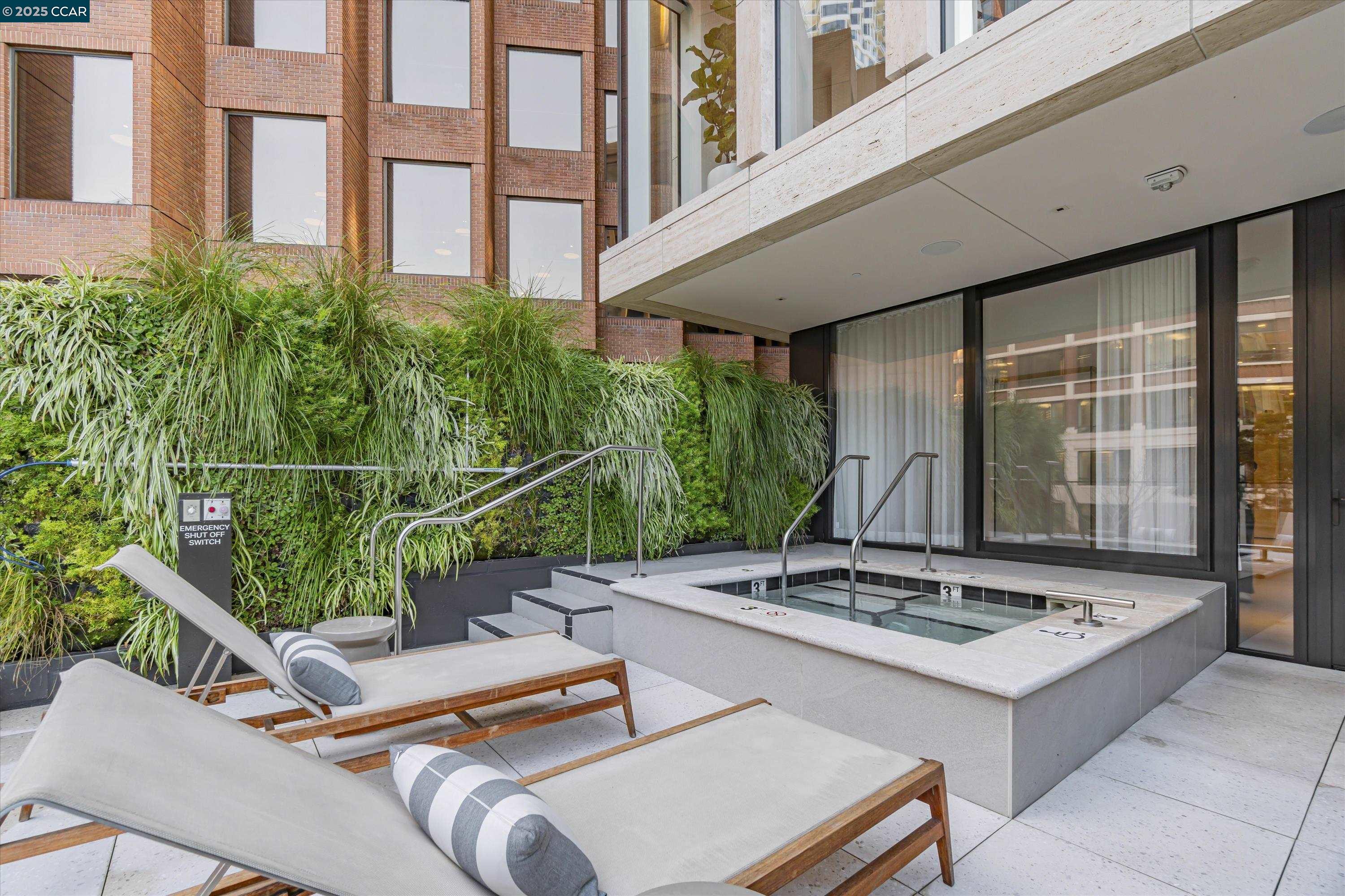 1 Steuart Street, Unit 1103 San Francisco, CA 94105 - Photo 28 of 31 a view of a patio with a table and chairs