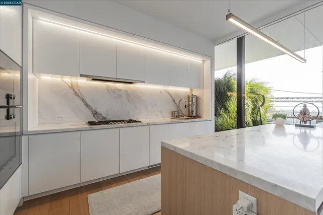 a kitchen with stainless steel appliances granite countertop a sink and a cabinets