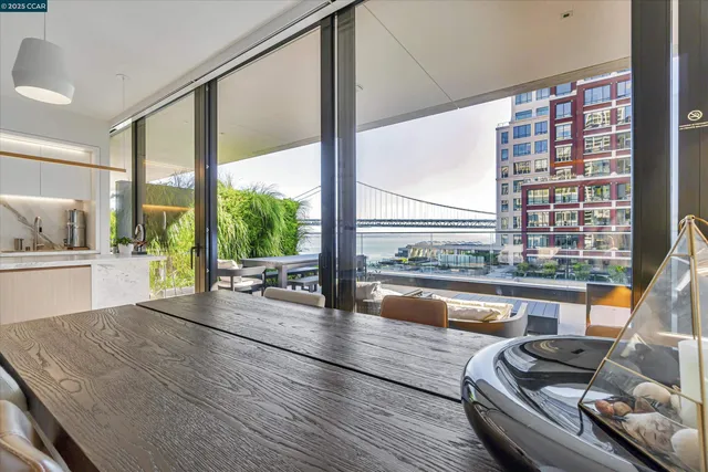 a lobby with furniture and floor to ceiling window