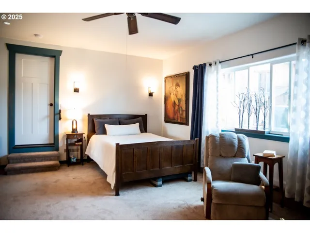 a bedroom with a bed and a couch