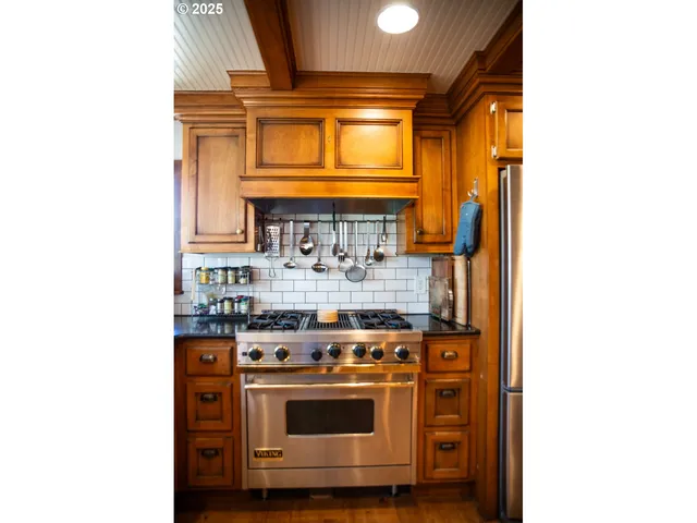 a kitchen with a stove and a microwave