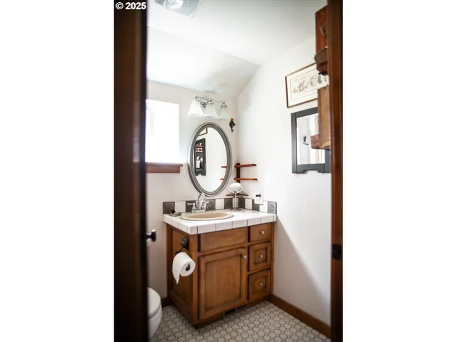 a utility room with sink dryer and washer