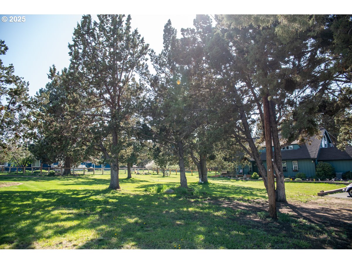 62725 Eagle Road Bend, OR 97701 - Photo 2 of 39 a view of swimming pool with a yard