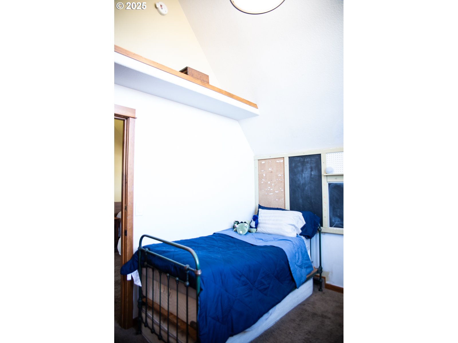 62725 Eagle Road Bend, OR 97701 - Photo 22 of 39 a bedroom with a bed and a night stand