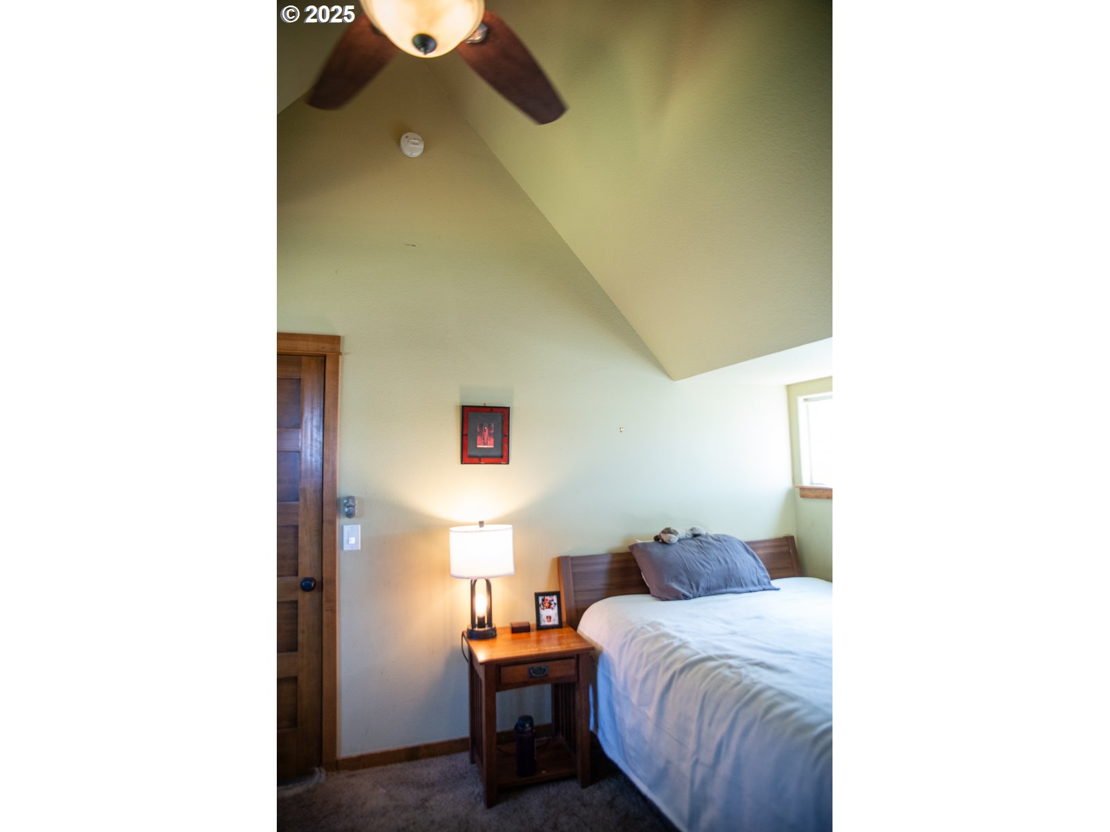 62725 Eagle Road Bend, OR 97701 - Photo 24 of 39 a bedroom with a bed and a painting on the wall
