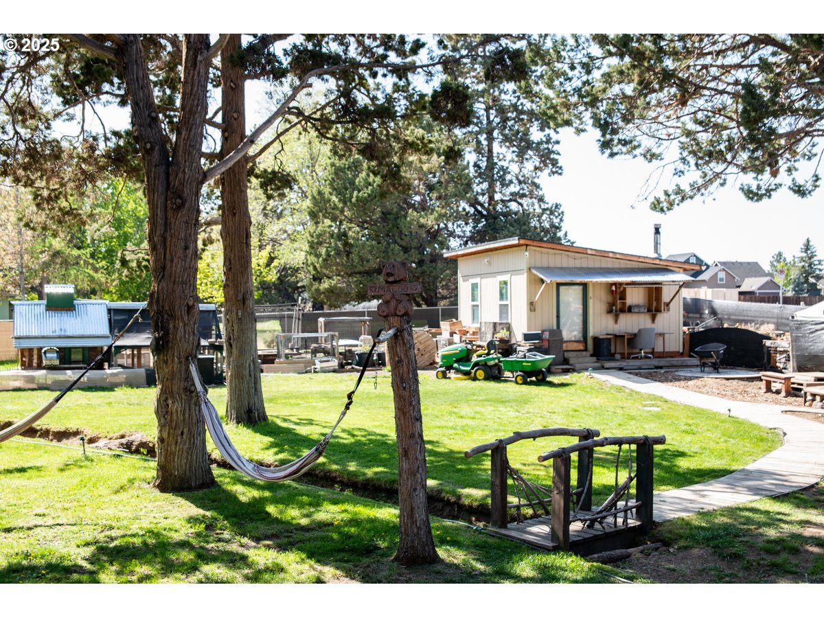 62725 Eagle Road Bend, OR 97701 - Photo 27 of 39 a view of a house with swimming pool and sitting area
