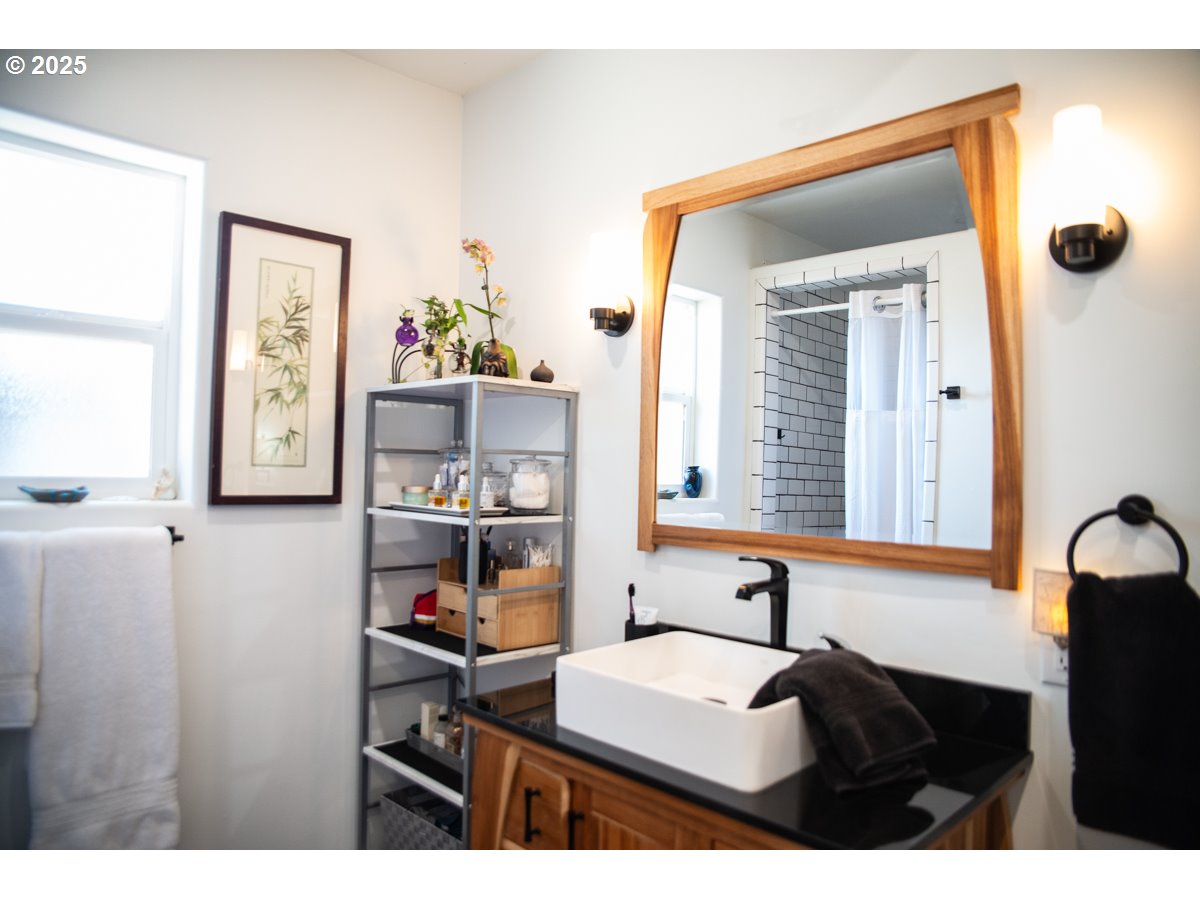 62725 Eagle Road Bend, OR 97701 - Photo 10 of 39 a bathroom with a sink and a mirror
