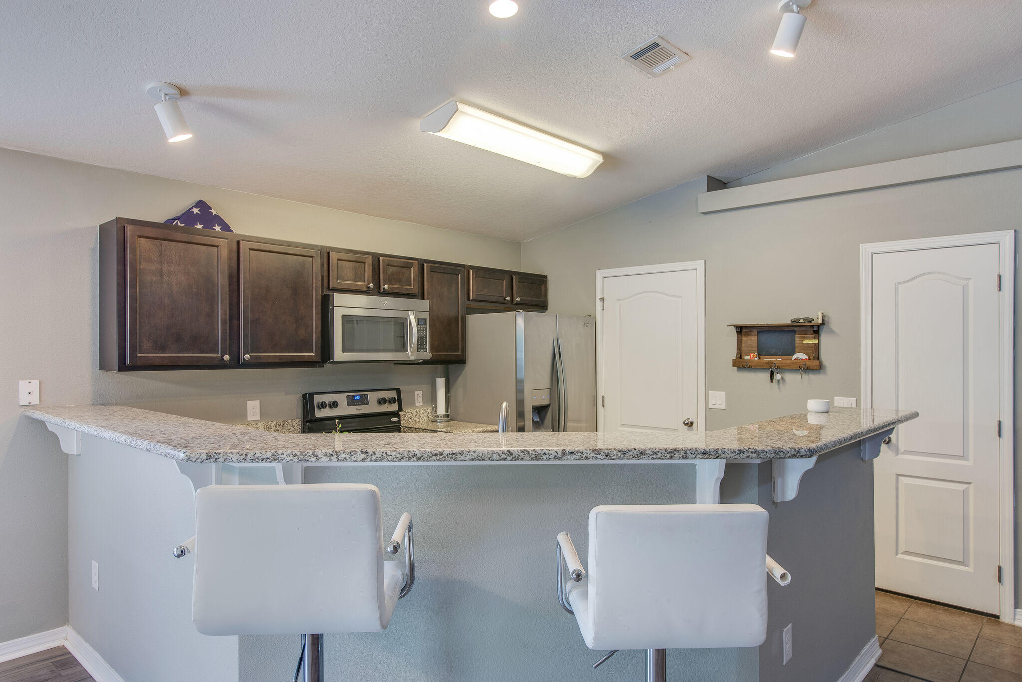 2362 Duncan Ridge Drive Navarre, FL 32566 - Photo 12 of 28 a kitchen with kitchen island granite countertop a sink and counter space