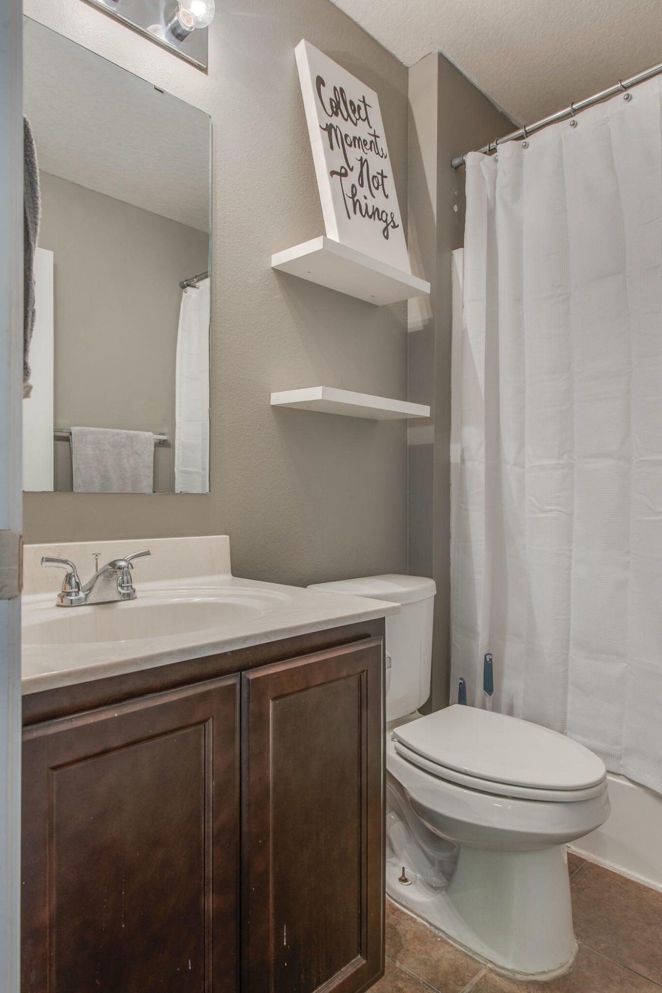 2362 Duncan Ridge Drive Navarre, FL 32566 - Photo 24 of 28 a bathroom with a sink a toilet and a mirror