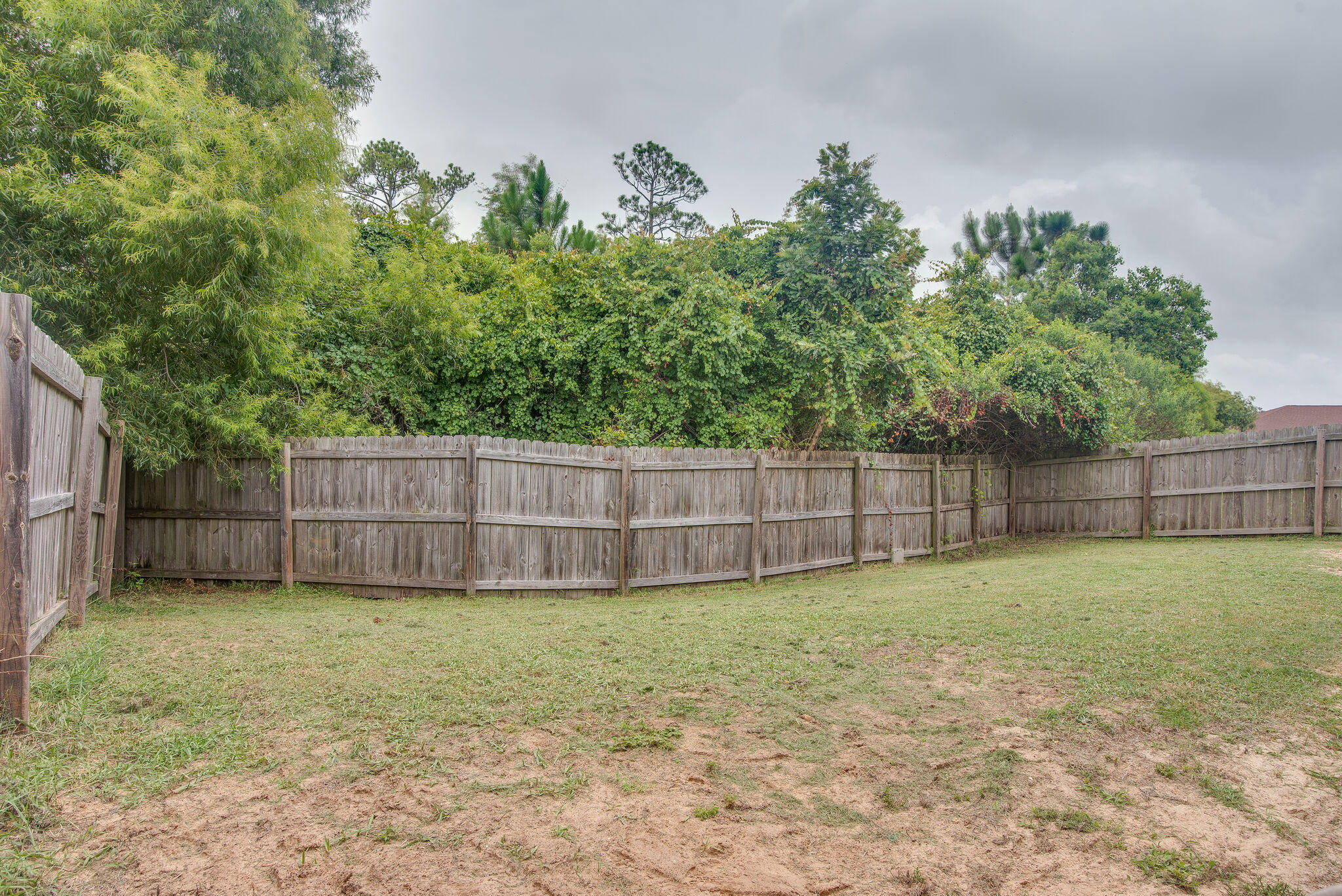 2362 Duncan Ridge Drive Navarre, FL 32566 - Photo 28 of 28 a view of a backyard with a fence