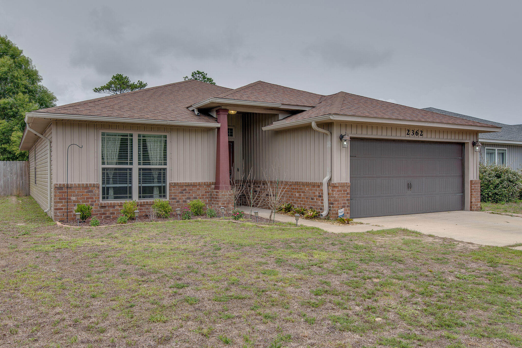 2362 Duncan Ridge Drive Navarre, FL 32566 - Photo 4 of 28 a house with yard in front of it
