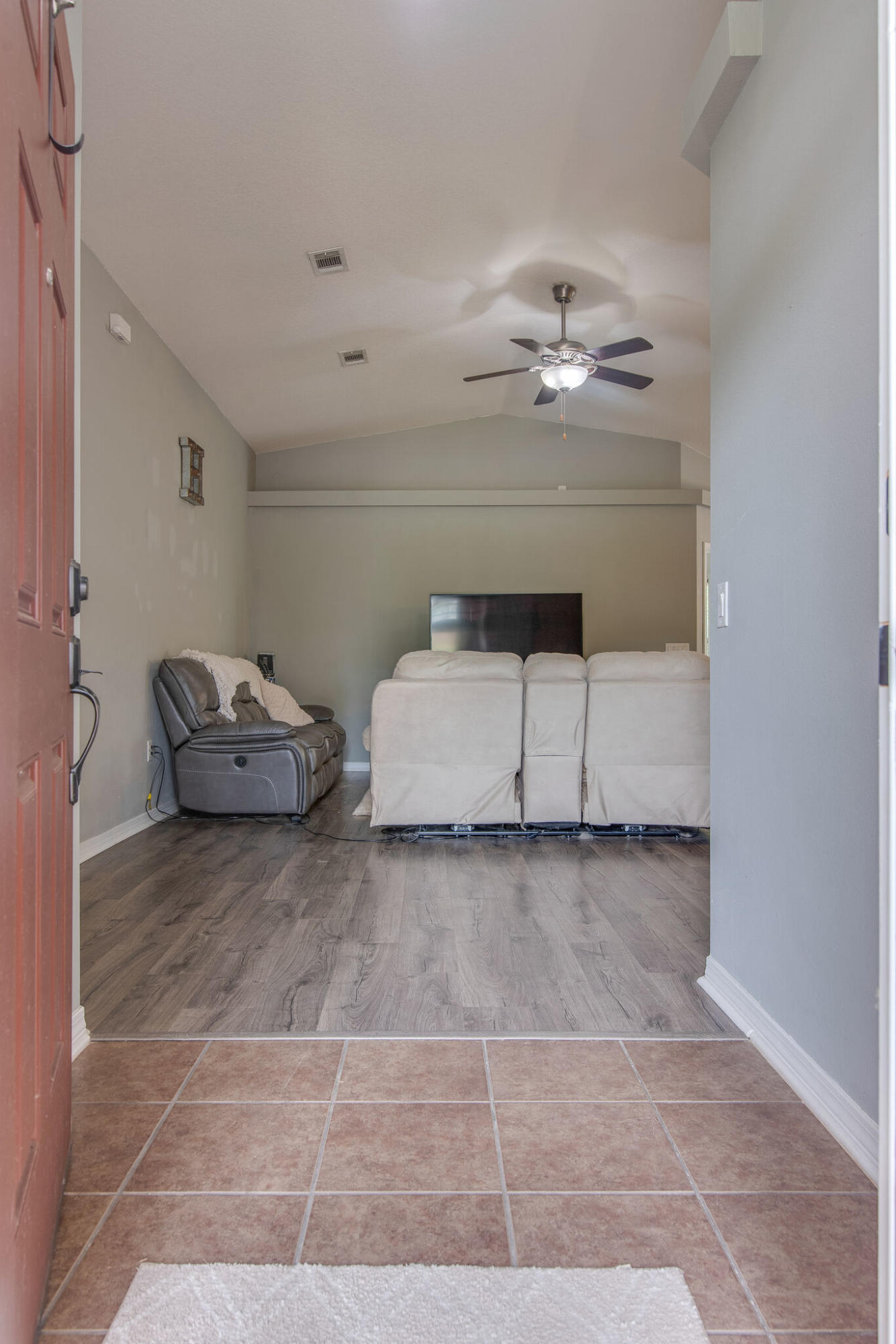 2362 Duncan Ridge Drive Navarre, FL 32566 - Photo 6 of 28 a living room with furniture and a ceiling fan