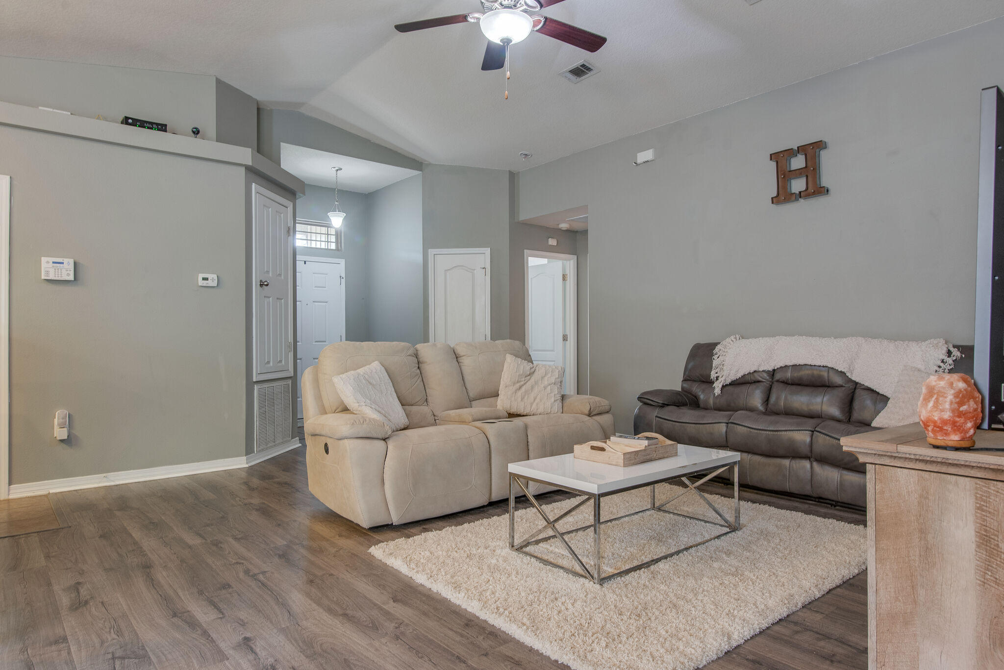 2362 Duncan Ridge Drive Navarre, FL 32566 - Photo 9 of 28 a living room with furniture and a chandelier