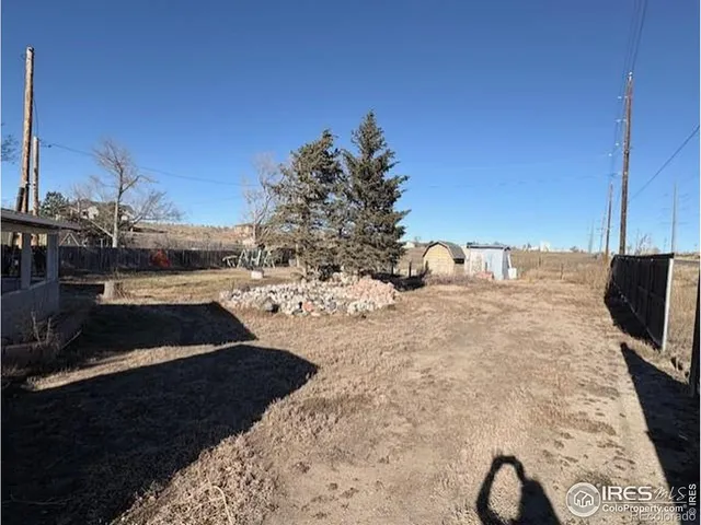 a view of a backyard of the house