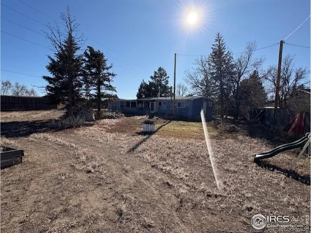 a view of a backyard of the house