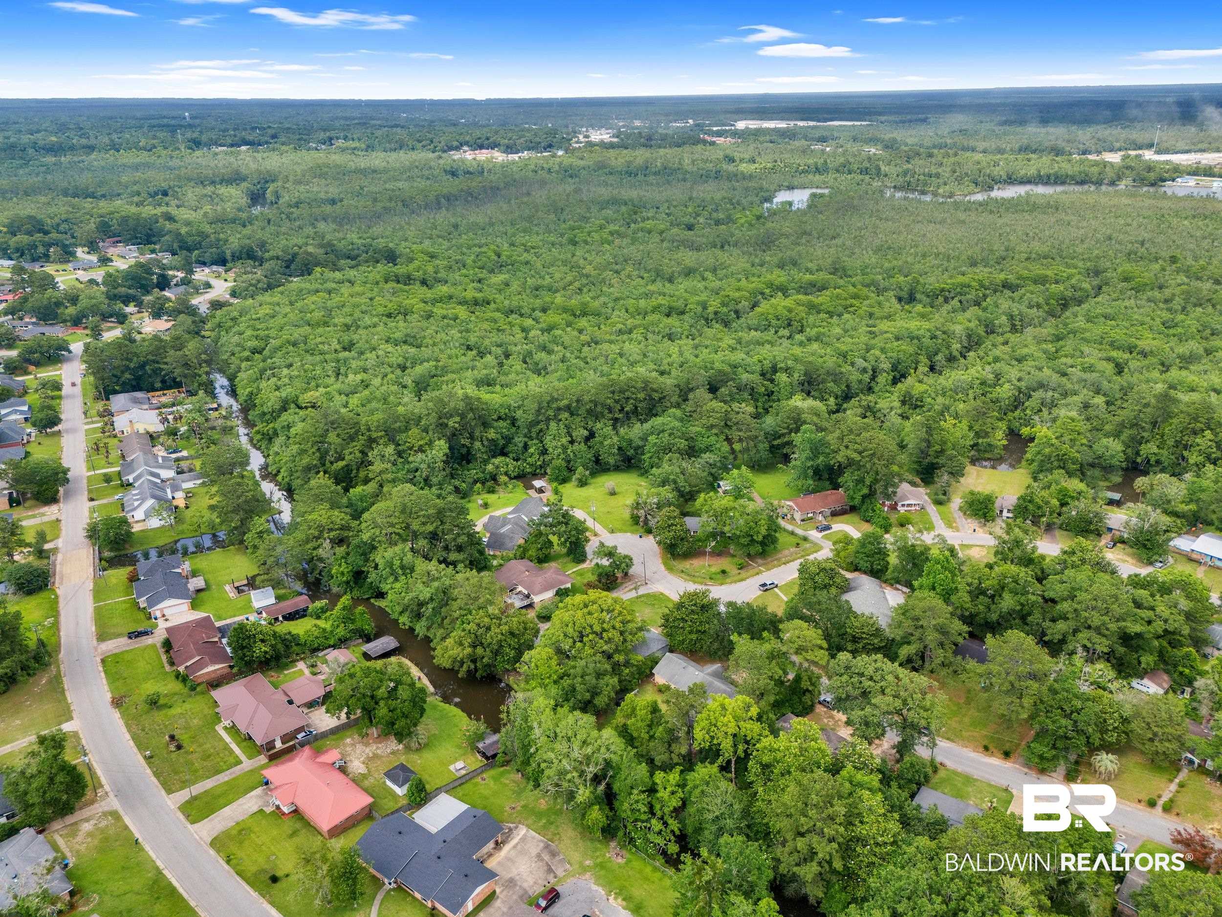 224 Cache Circle Mobile, AL 36611 - Photo 32 of 42 View of property location with a heavily wooded area and nearby suburban area