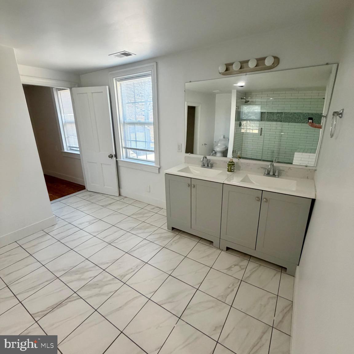 17700 Barnesville Road Dickerson, MD 20842 - Photo 12 of 20 Spacious, modern bathroom with natural light.