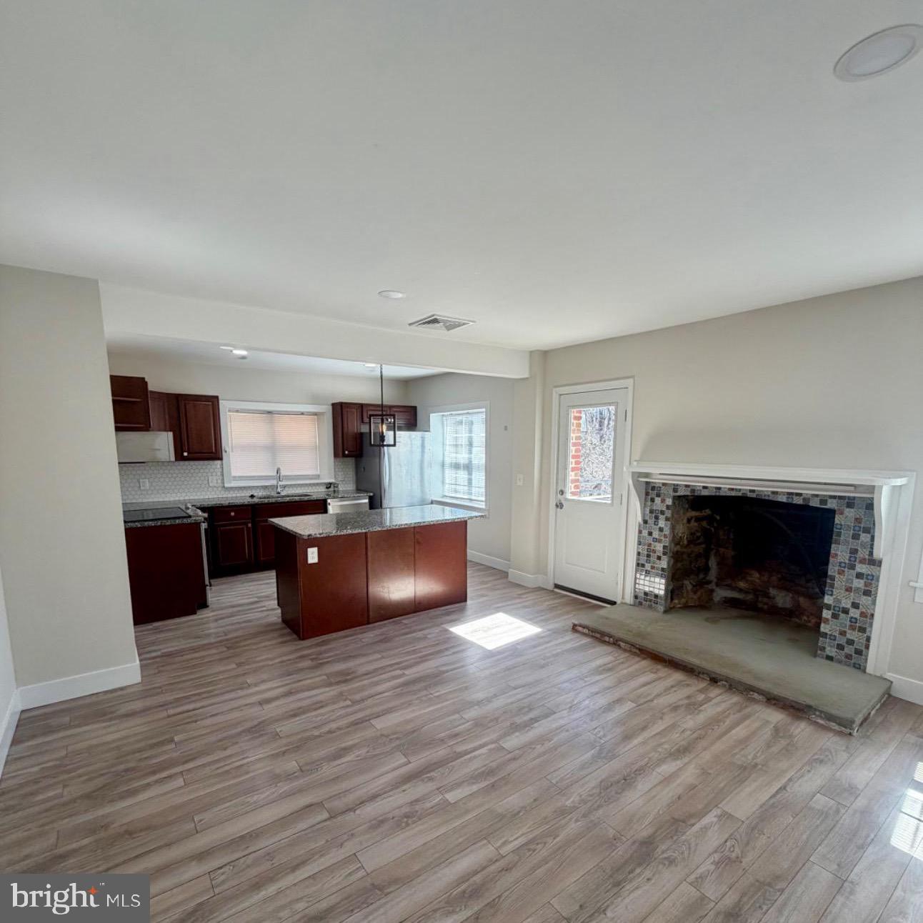 17700 Barnesville Road Dickerson, MD 20842 - Photo 5 of 20 Spacious living area with cozy fireplace.