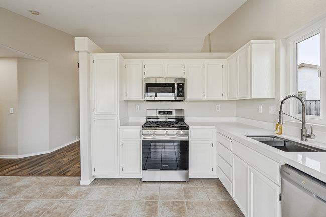 2240 Preston Court Hollister, CA 95023 - Photo 11 of 21 a kitchen with cabinets stainless steel appliances and a sink